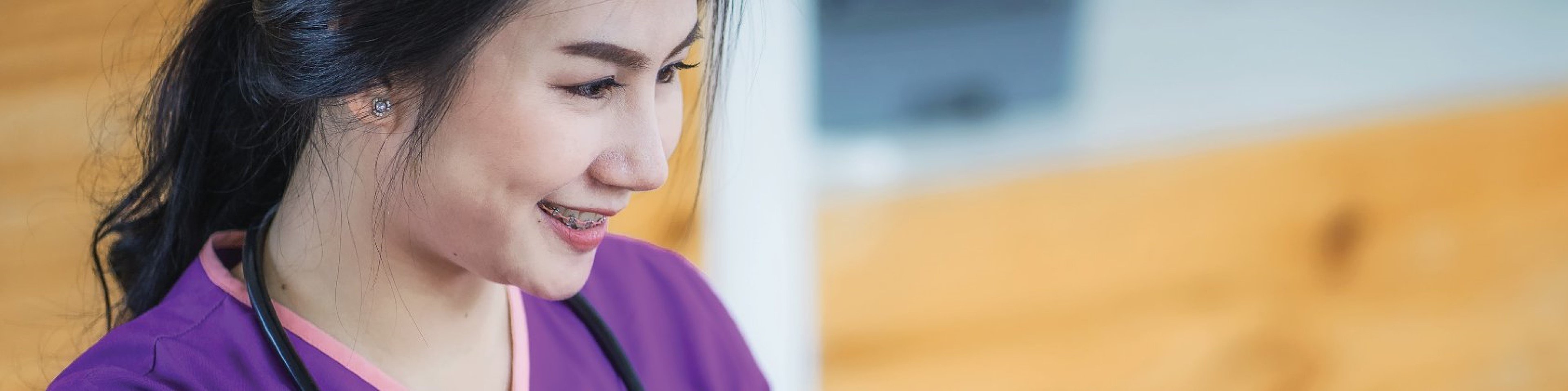 Nursing student watching instructor