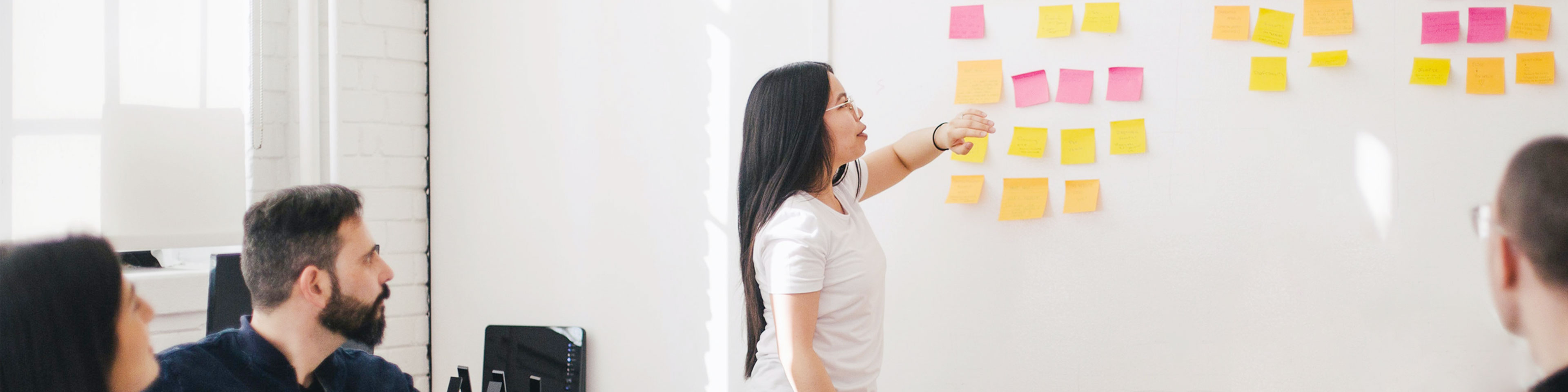 Agile team member explains project to coworkers