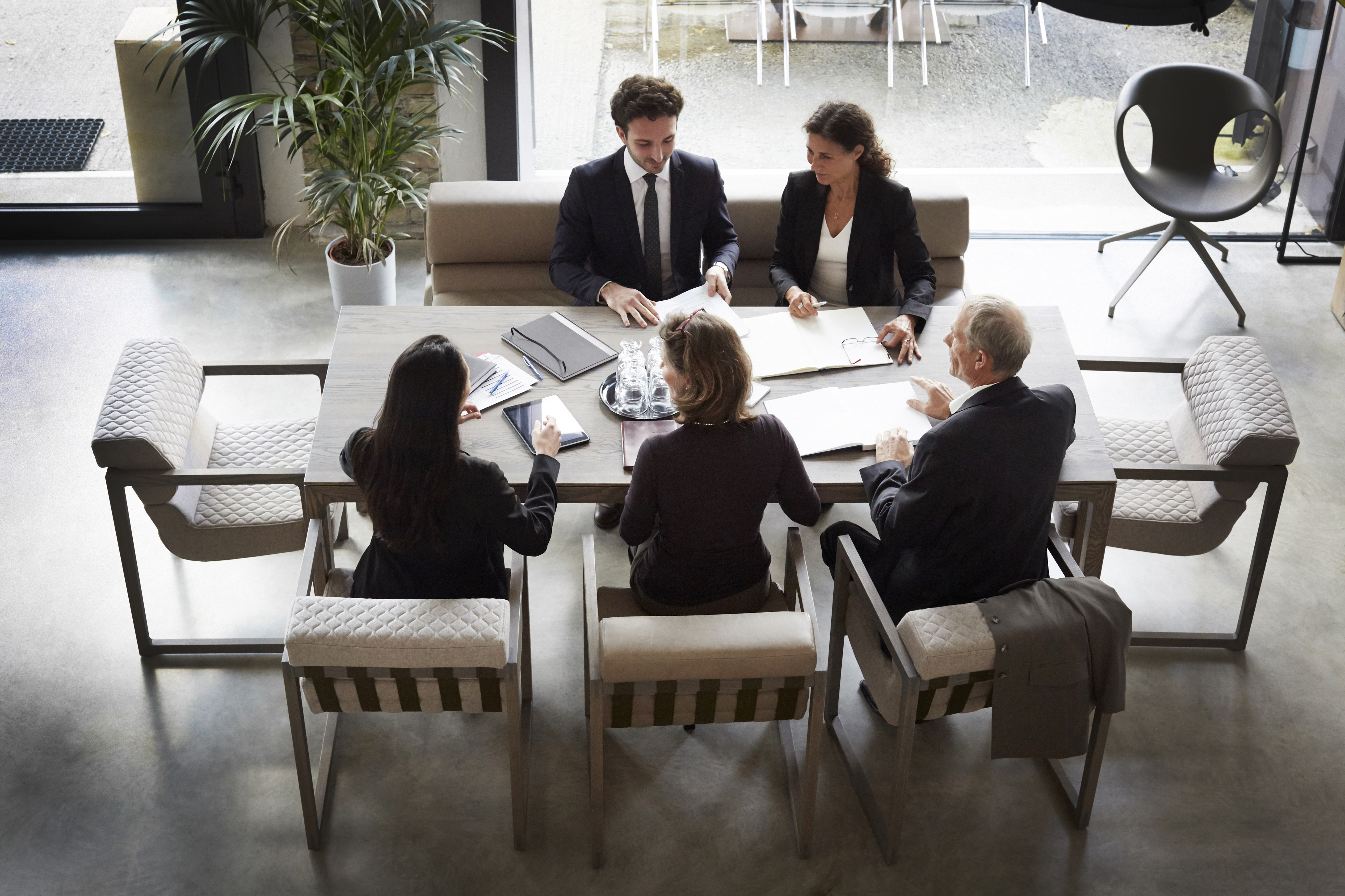 Financial advisors and customers meeting at law firm.