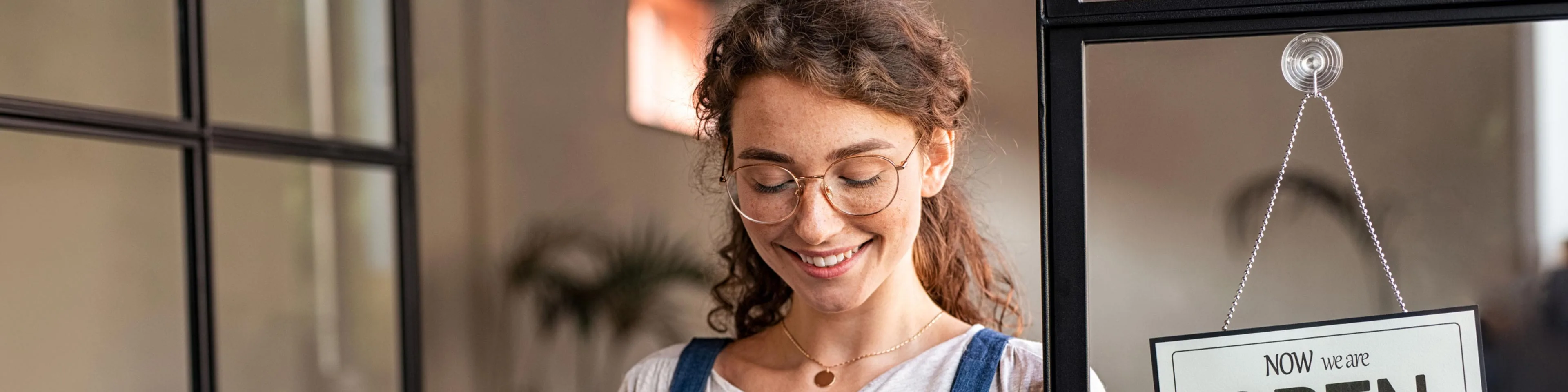 woman in a small shop analyzing factors that affect cash flow