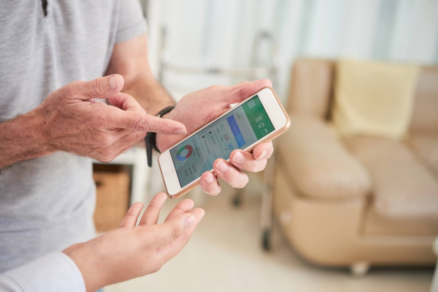 Patient looking at data on cell phone