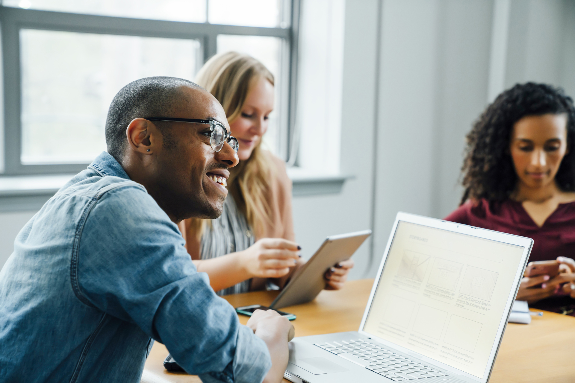 Business people using technology in meeting