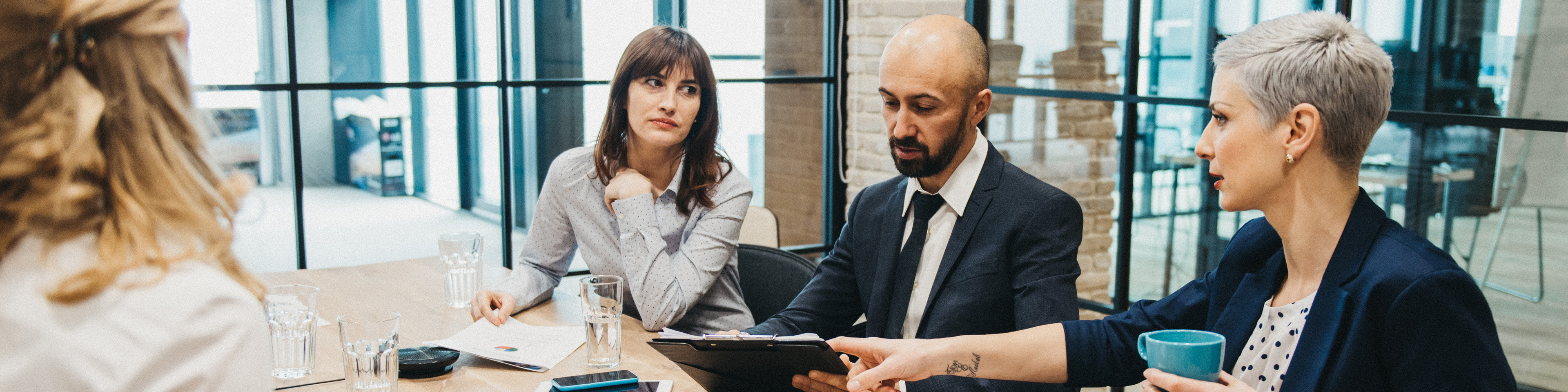 Coworkers discussing in a Board meeting 