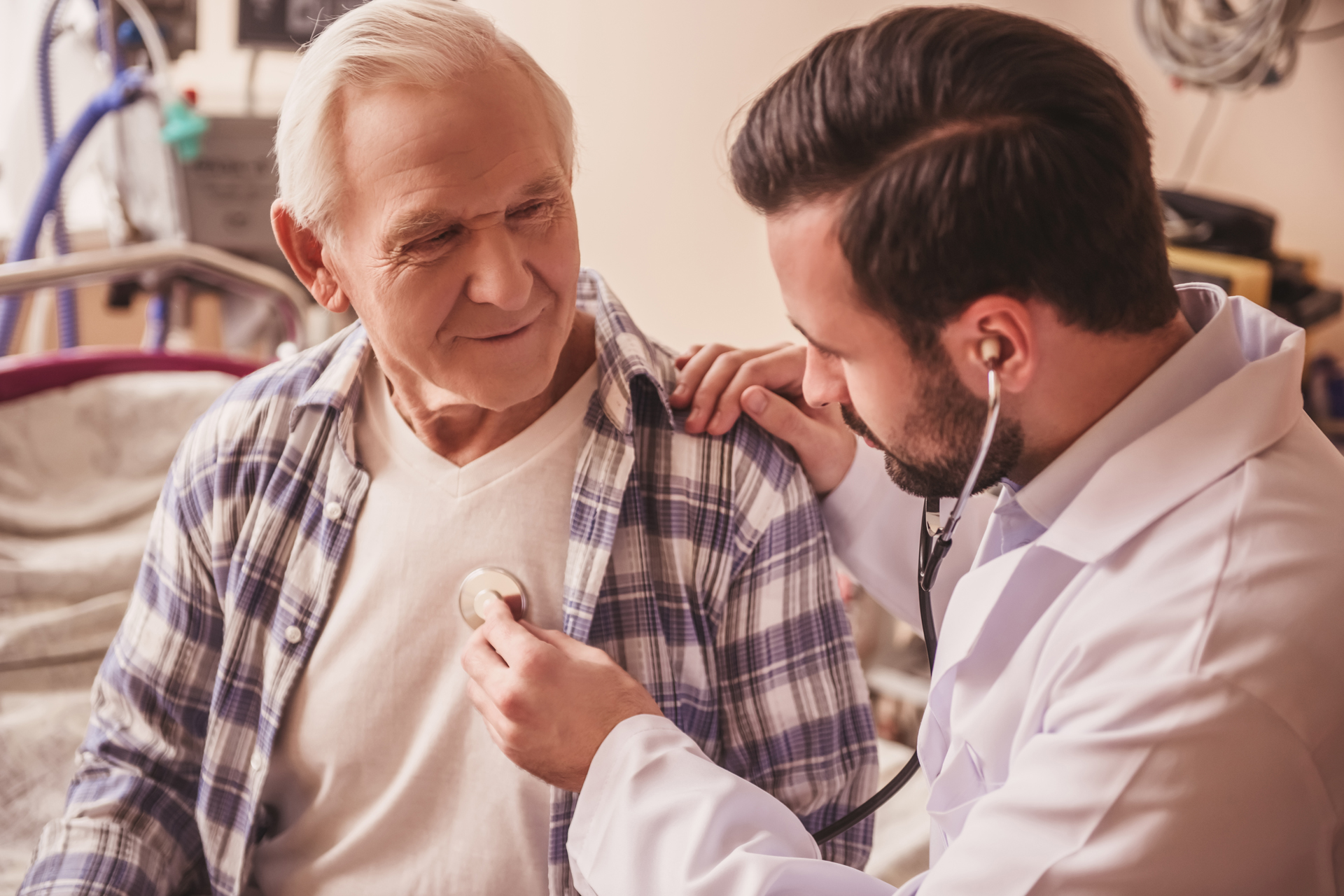 Older gentleman getting physical exam at doctor's office