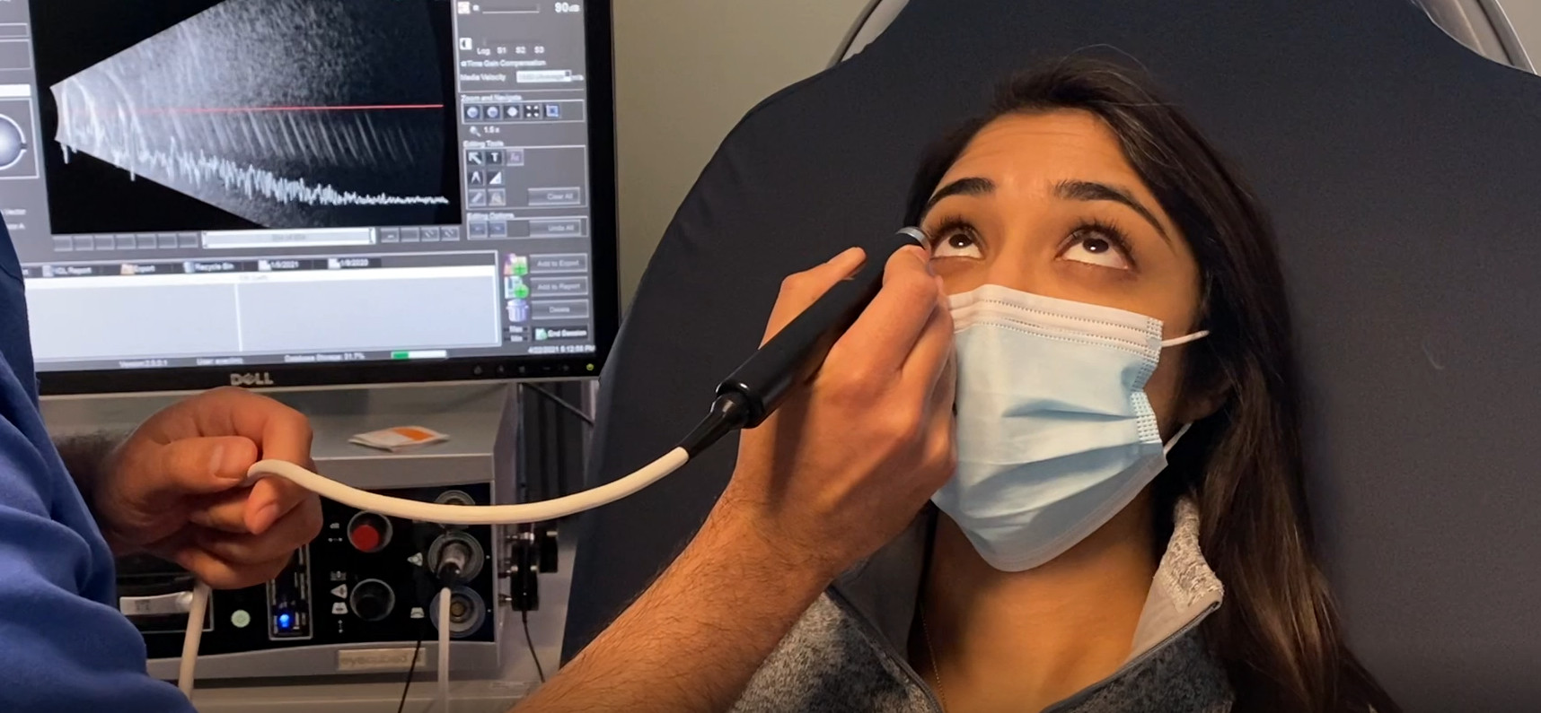 Young female patient being given an eye examination