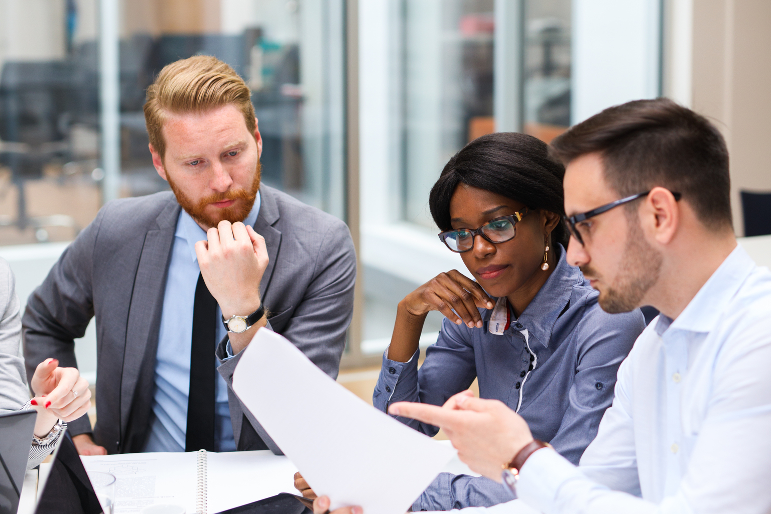 Business people discussing strategy with a financial analyst