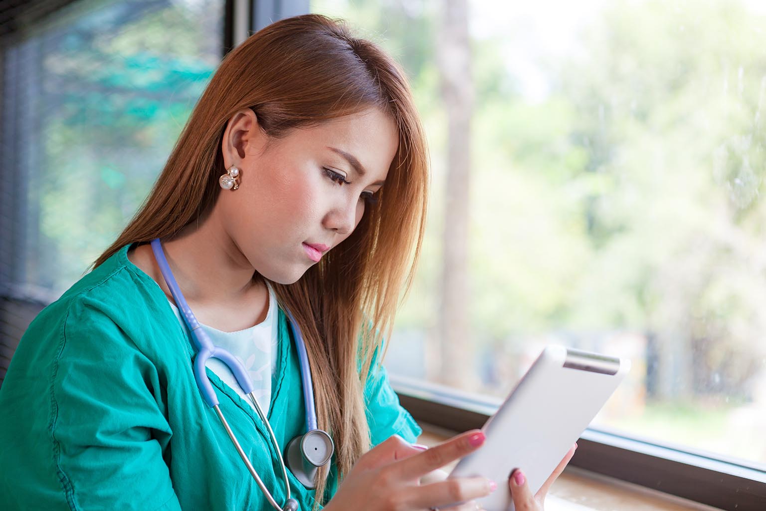 nurse on tablet