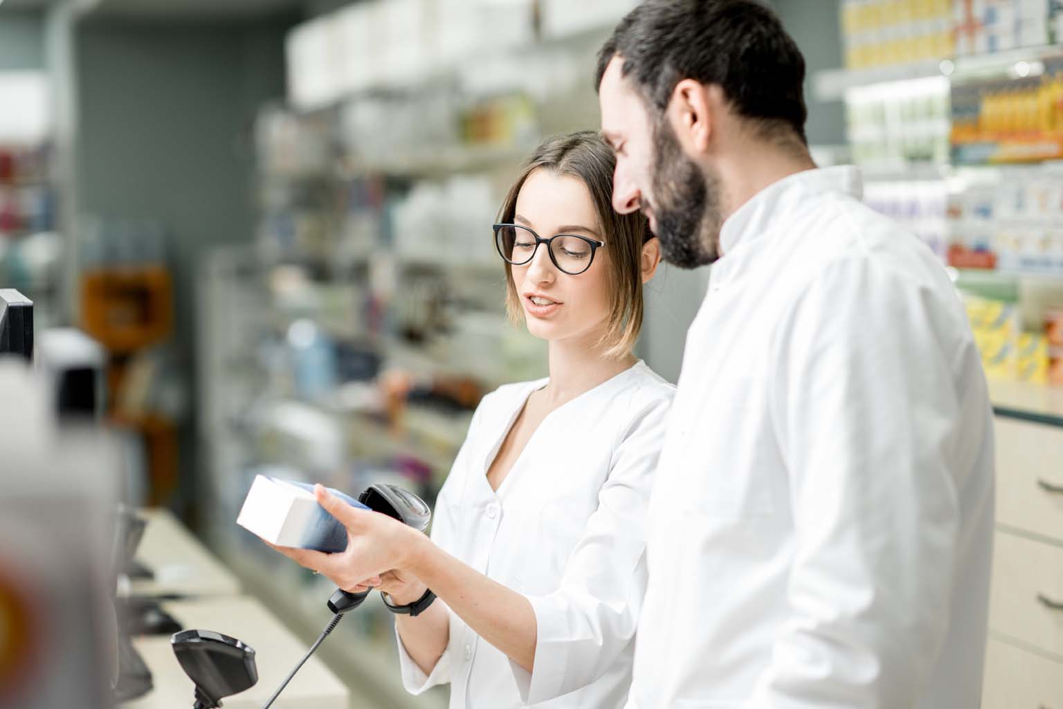 pharmacists scanning medication in pharmacy