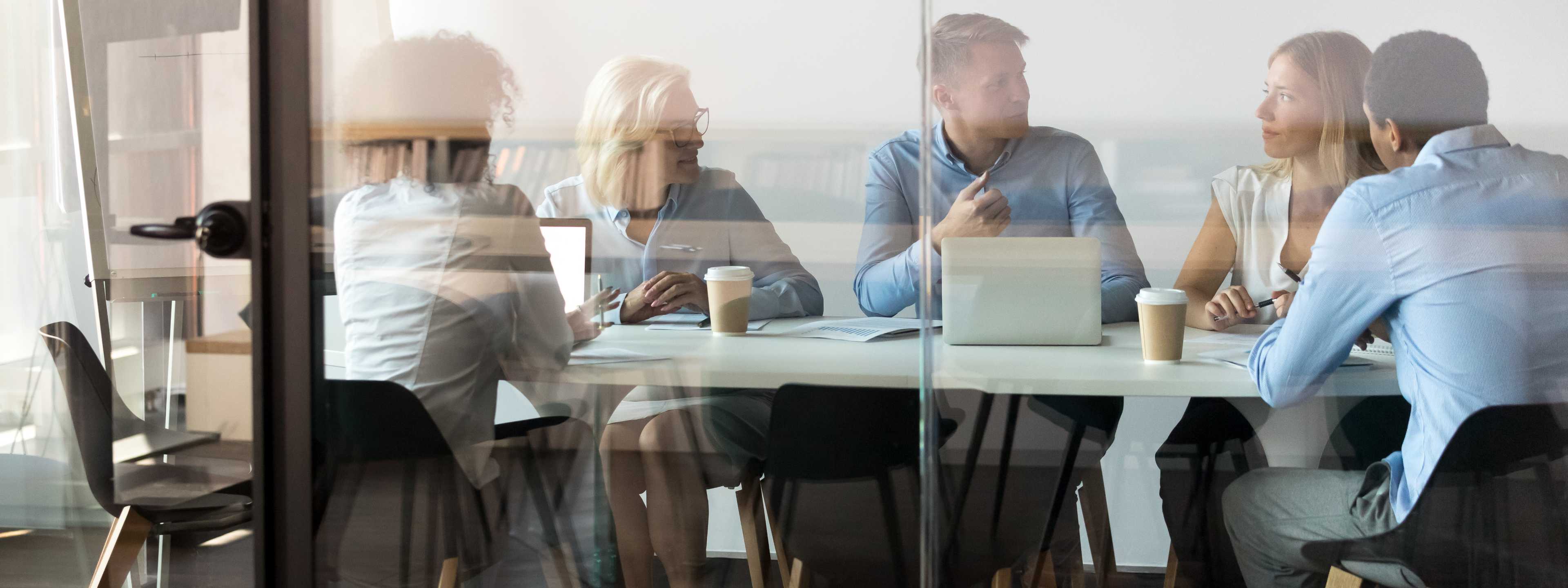 Group meets at conference table