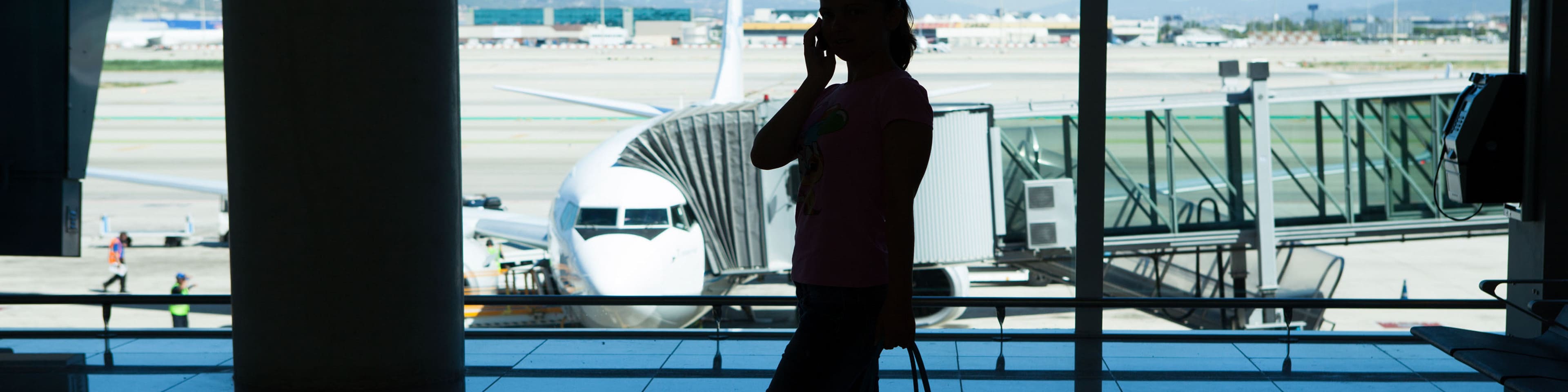airport gate airplane terminal silhouette woman
