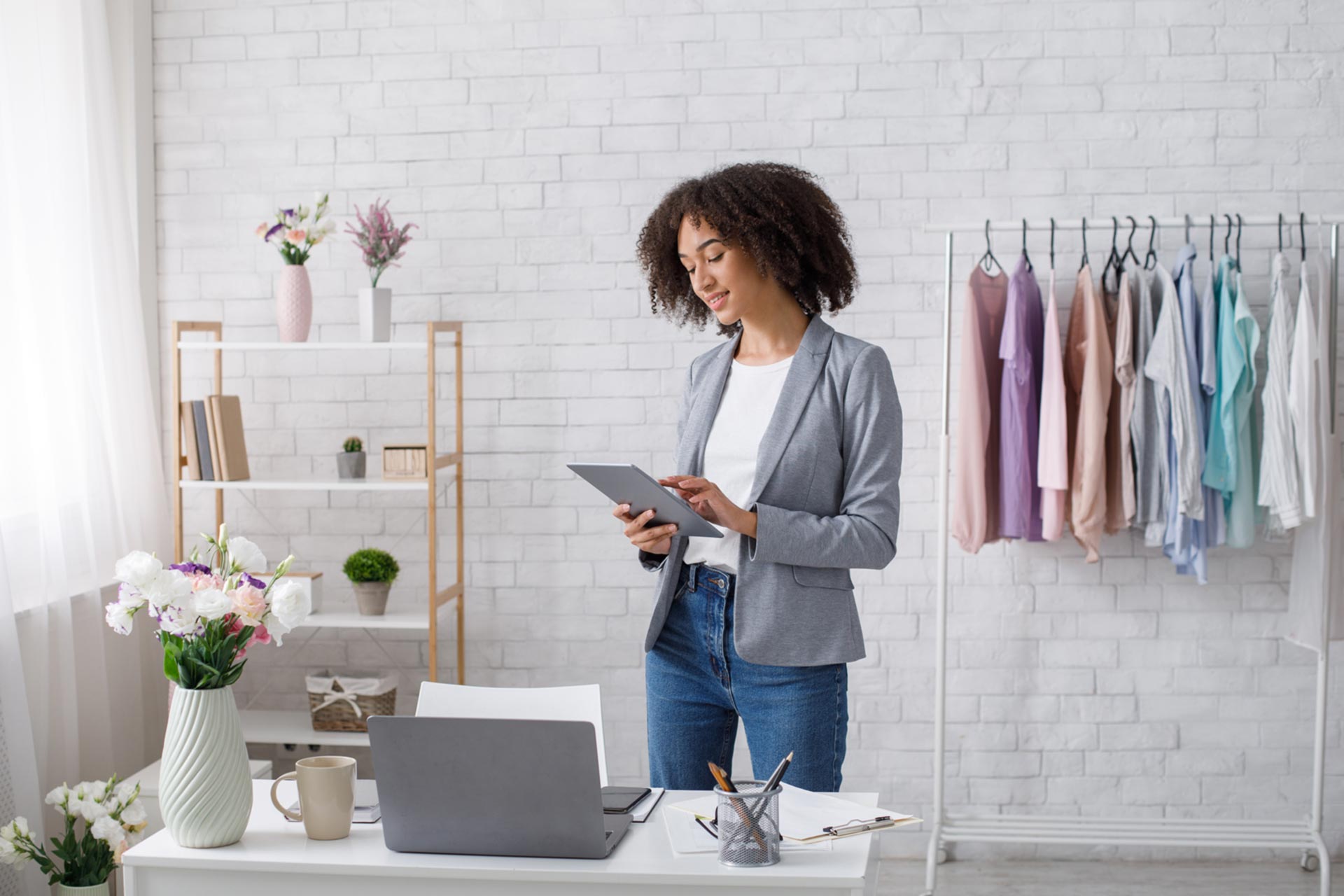 Business owner reviewing Certificate of Good Standing on tablet