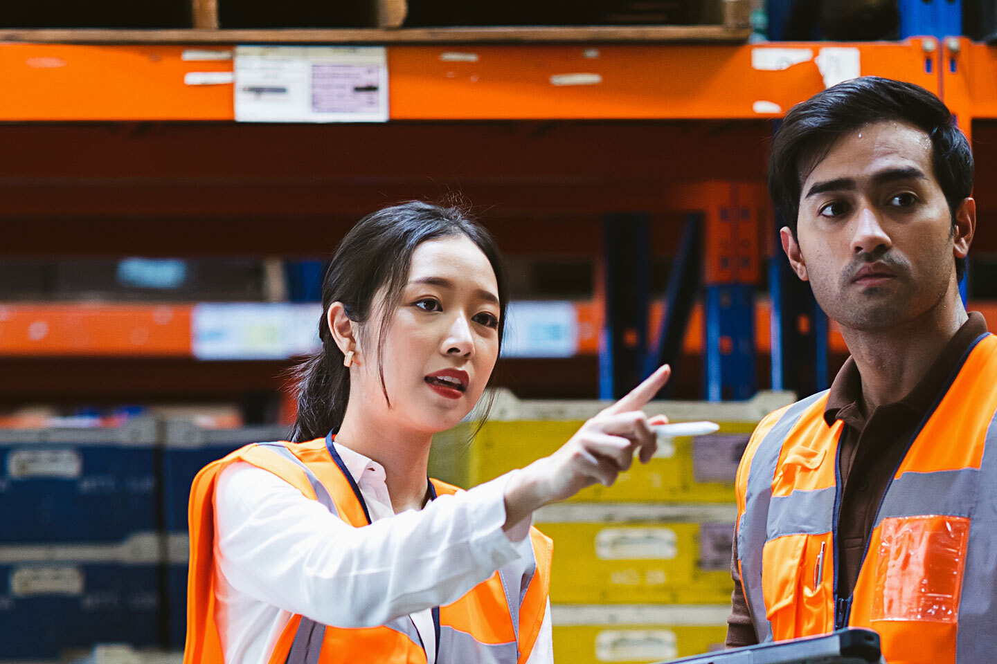 Two retail workers in the warehouse
