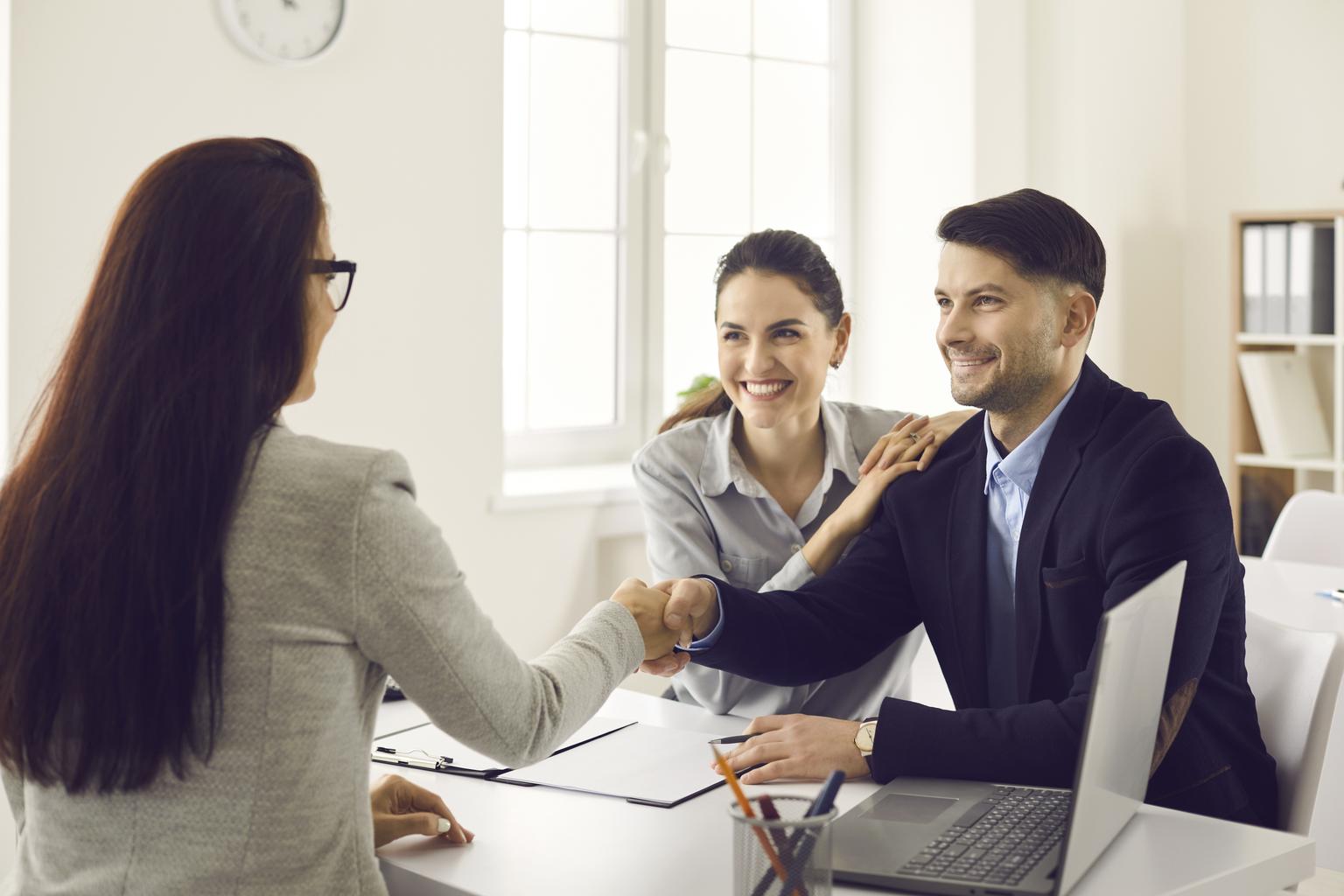 a couple meeting with a loan officer