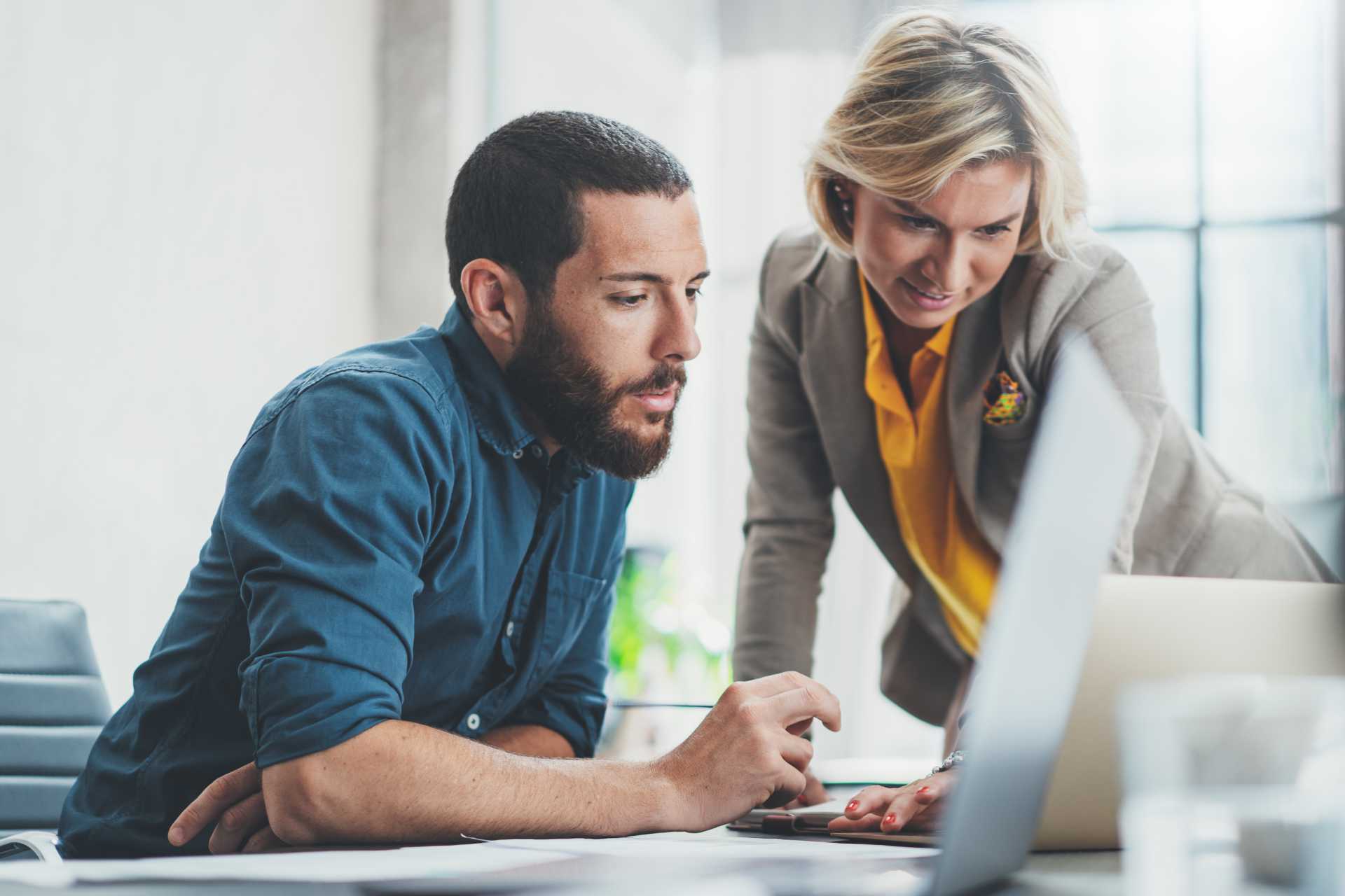 Man and woman at laptop