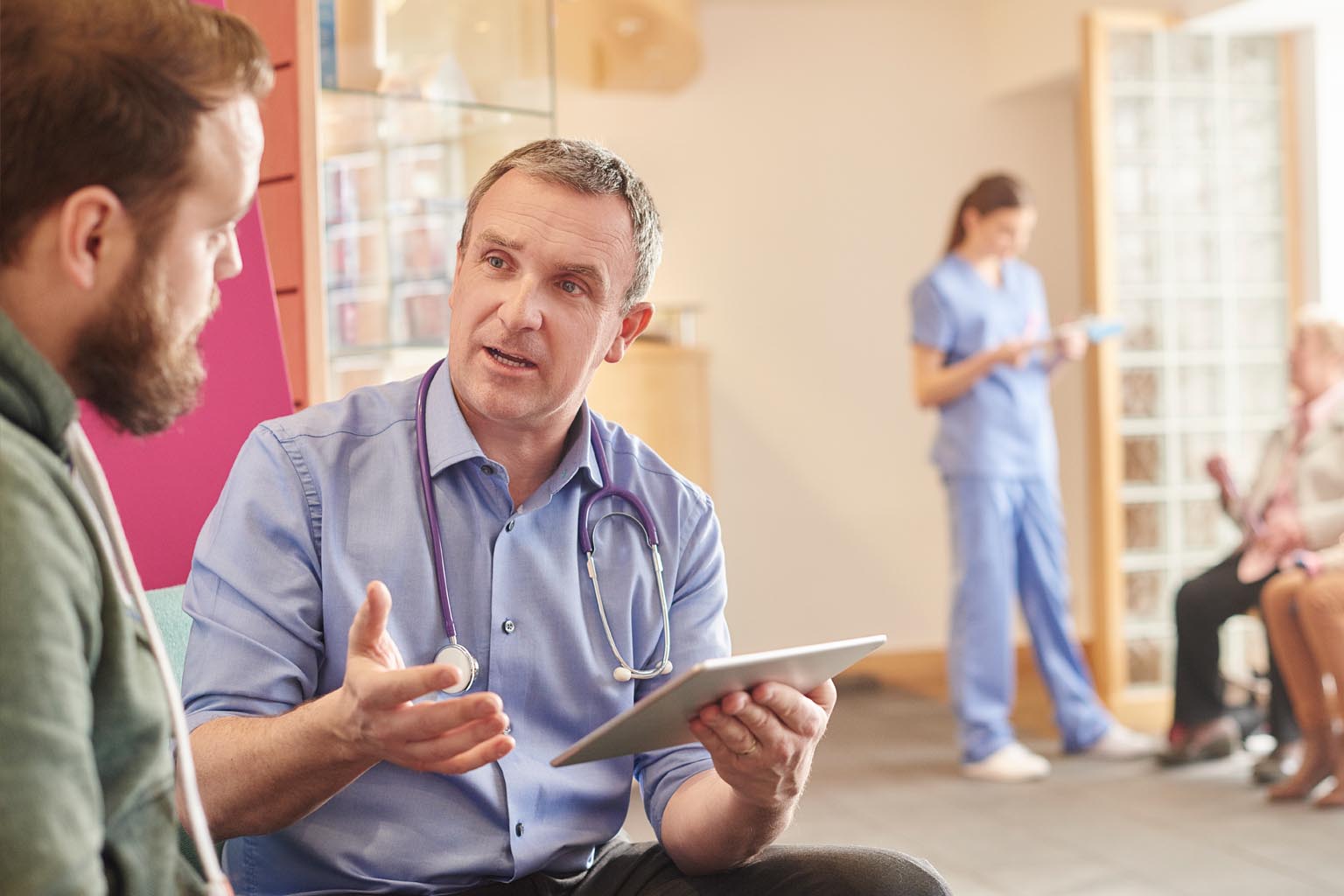 clinicians with patients and devices in lobby