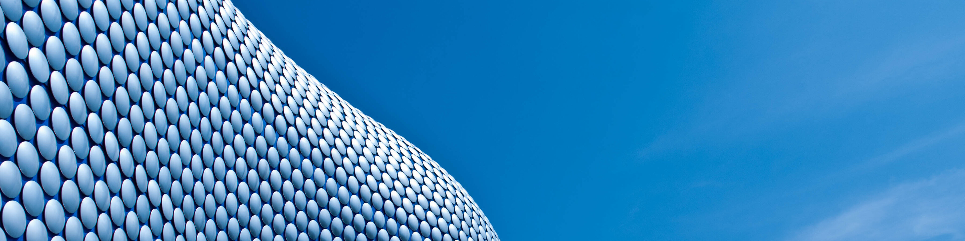 Close-up of modern building against blue sky, Birmingham, USA,