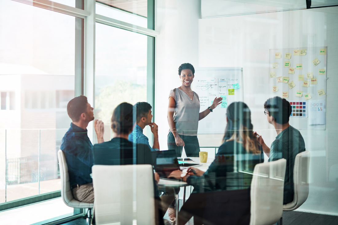 Shot of a group of business people having a meeting in a modern office