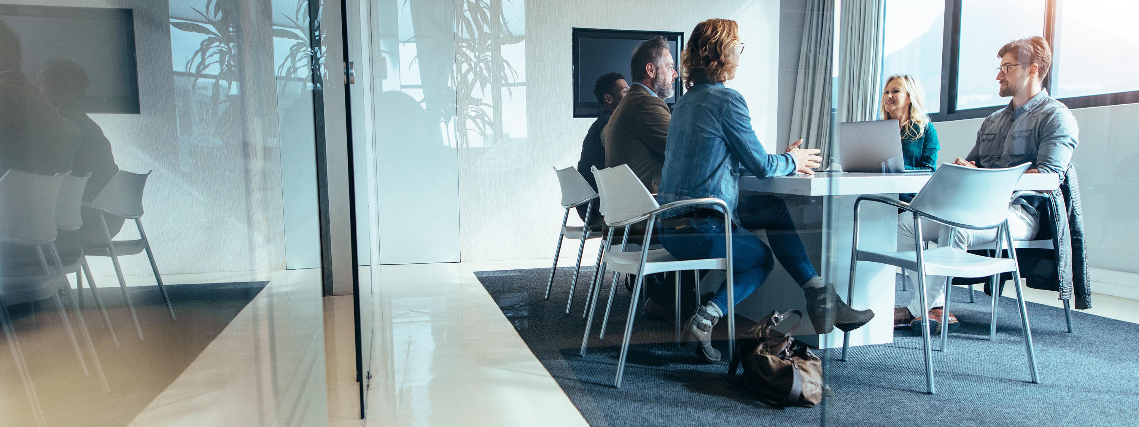 business people in a small meeting room