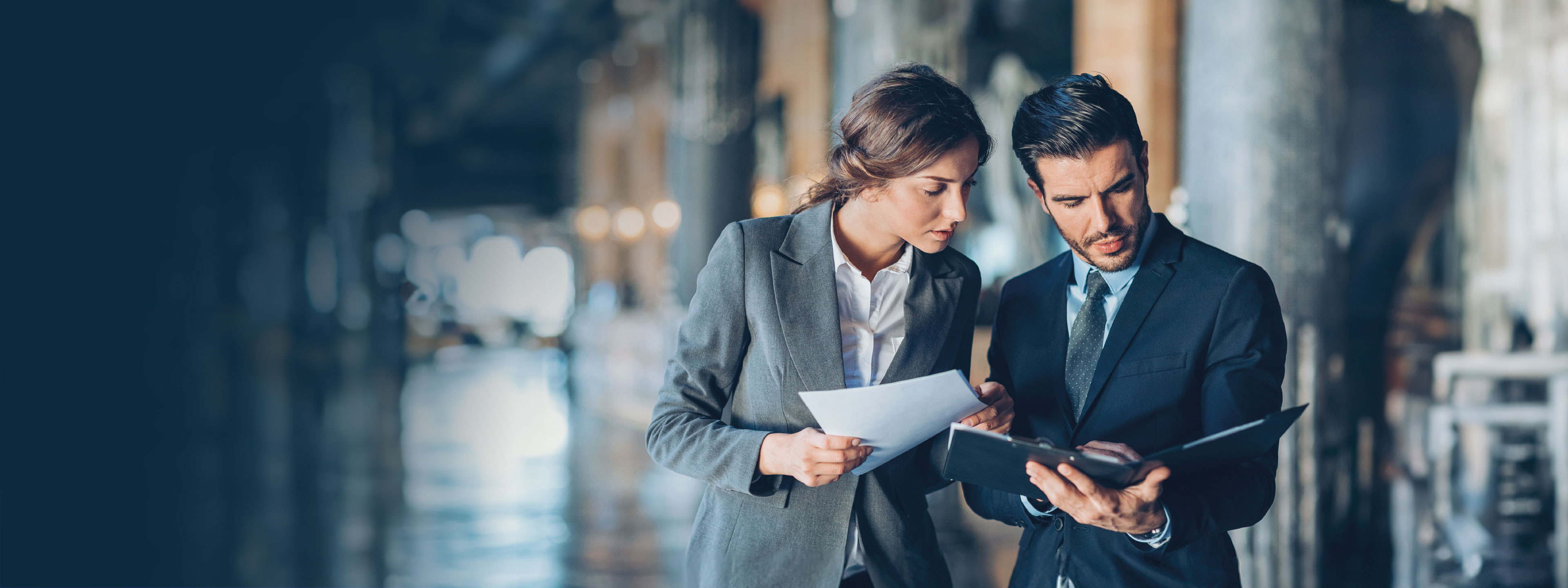 two people looking at docs