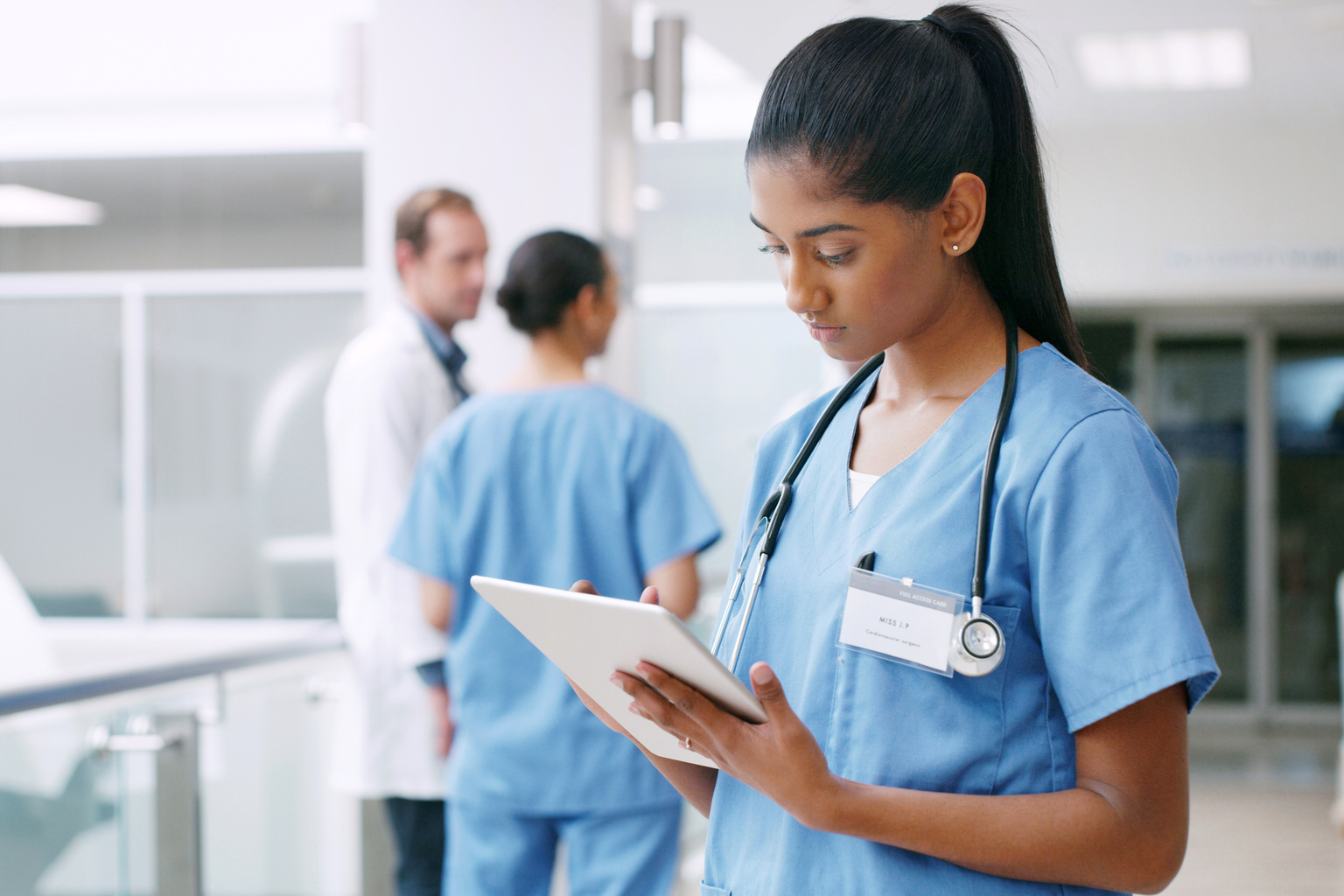 Young nurse using a digital tablet in a hospital.