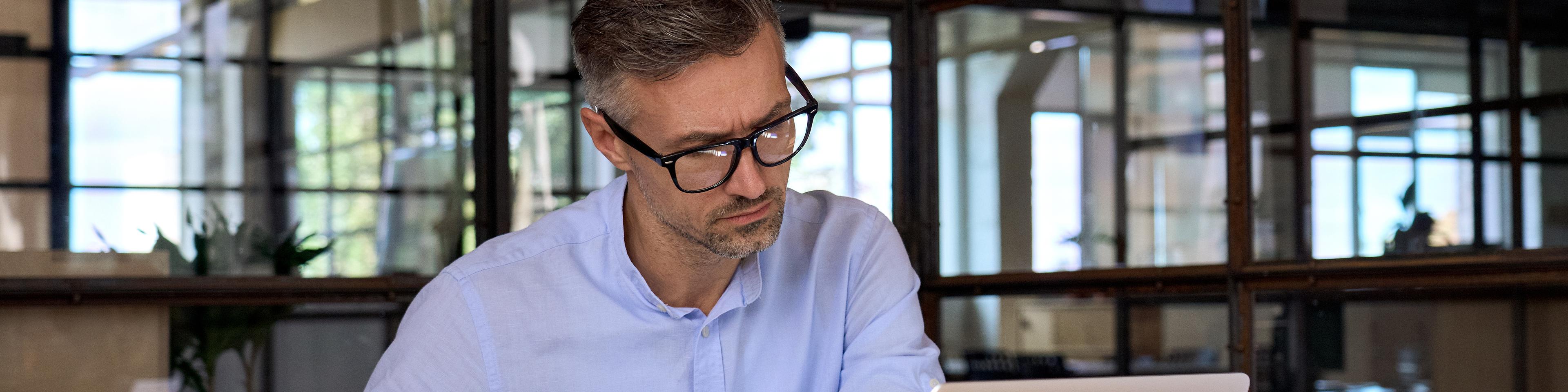 businessman w laptop at office