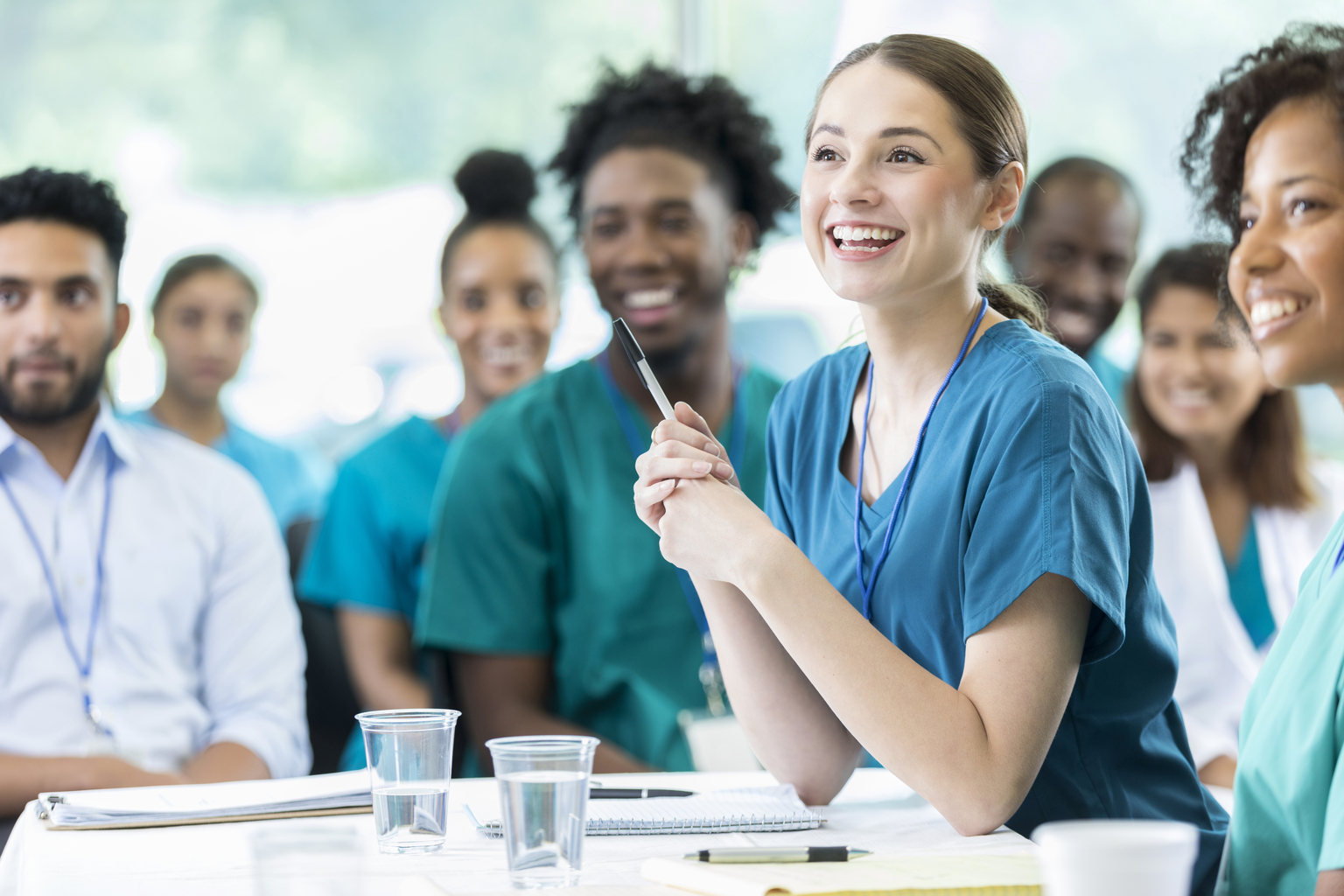 Young nurses of mixed ethnicity and gender in classroom.