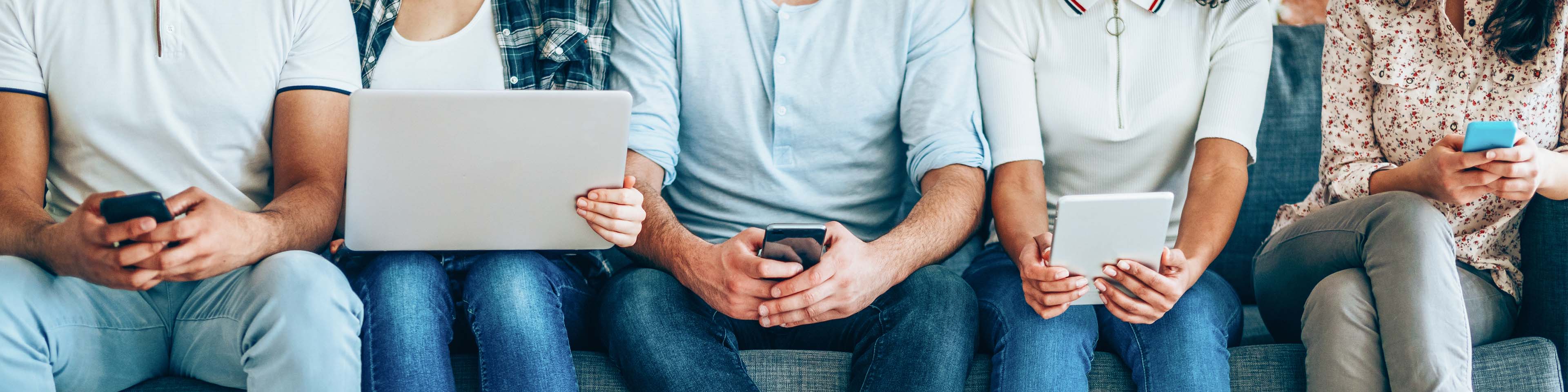 Image of people working on devices 