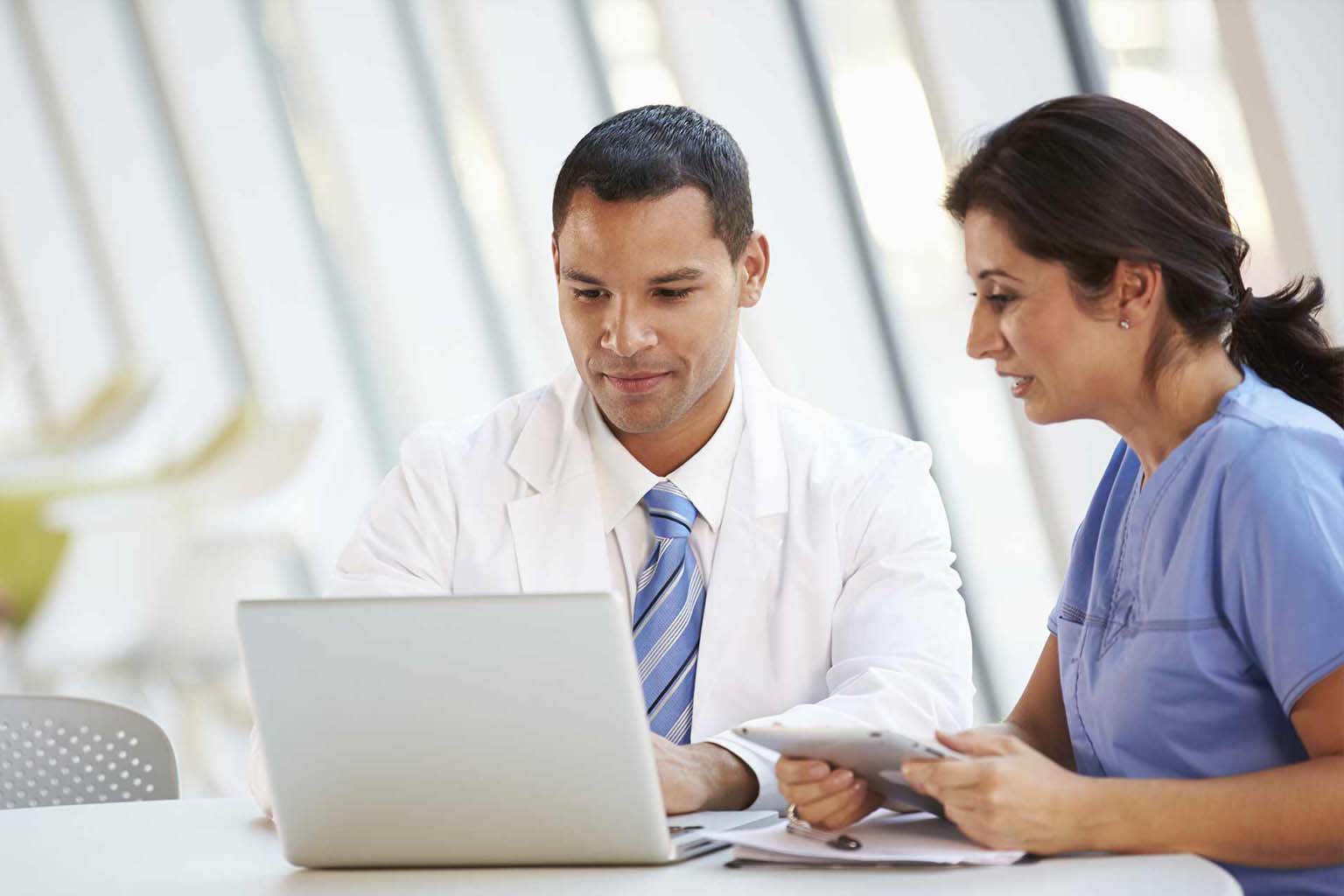 clinicians using laptop