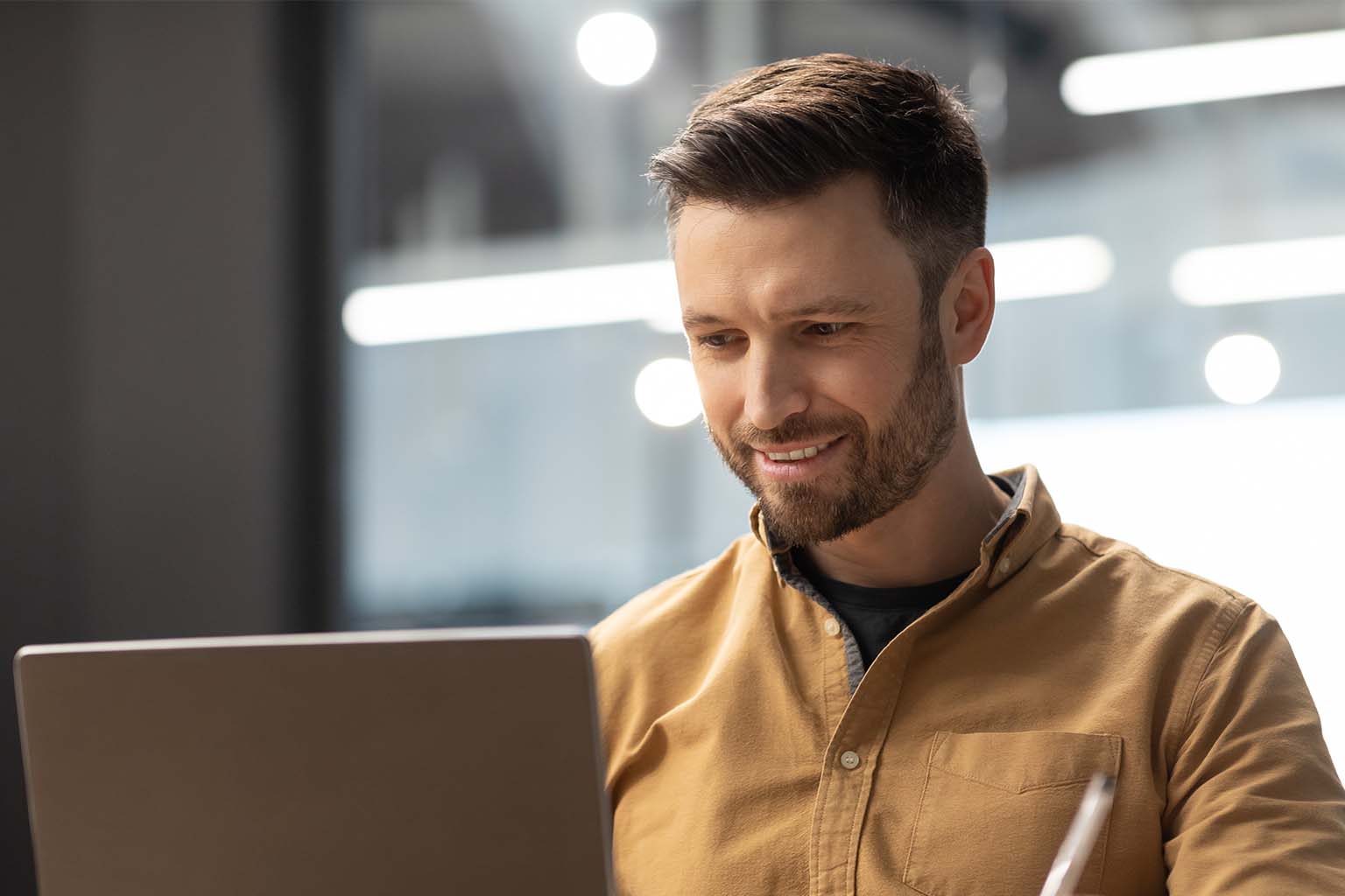 Man reading on a laptop