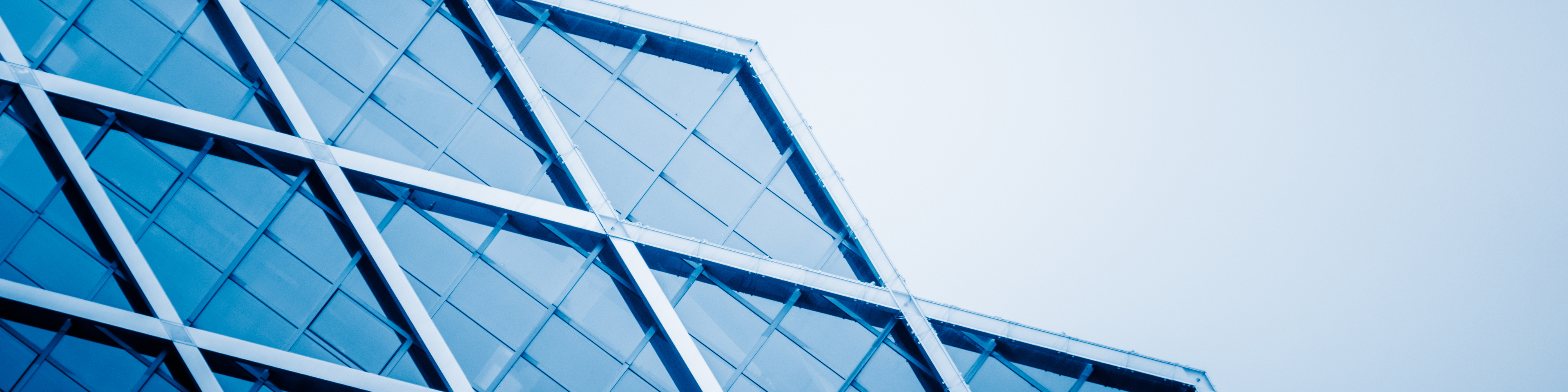 detail of modern glass building, blue toned.