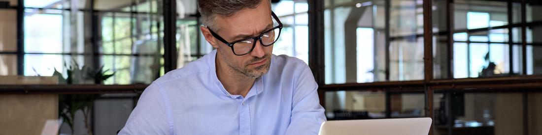 businessman w laptop at office