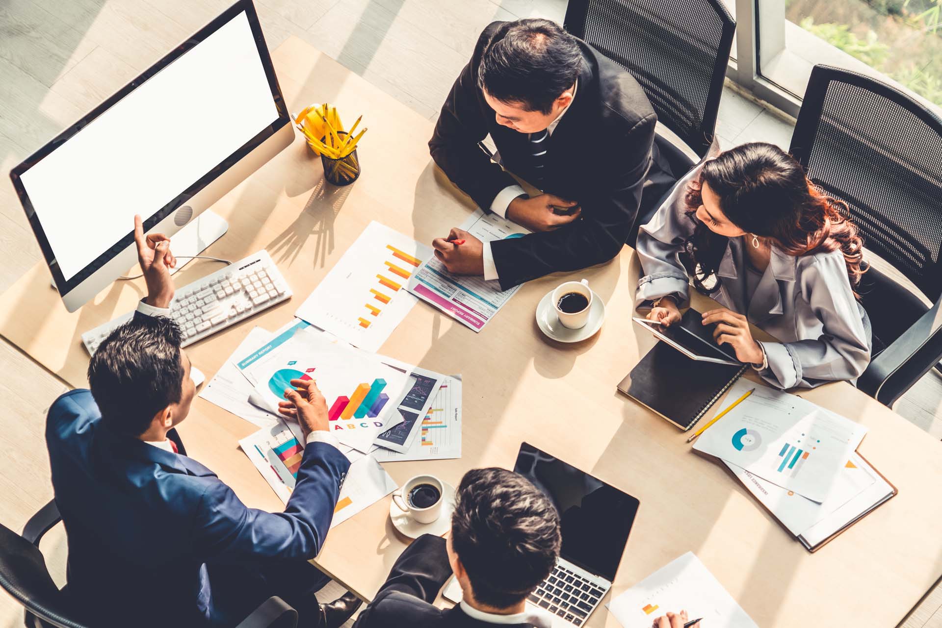 people collaborating around a table about lien management