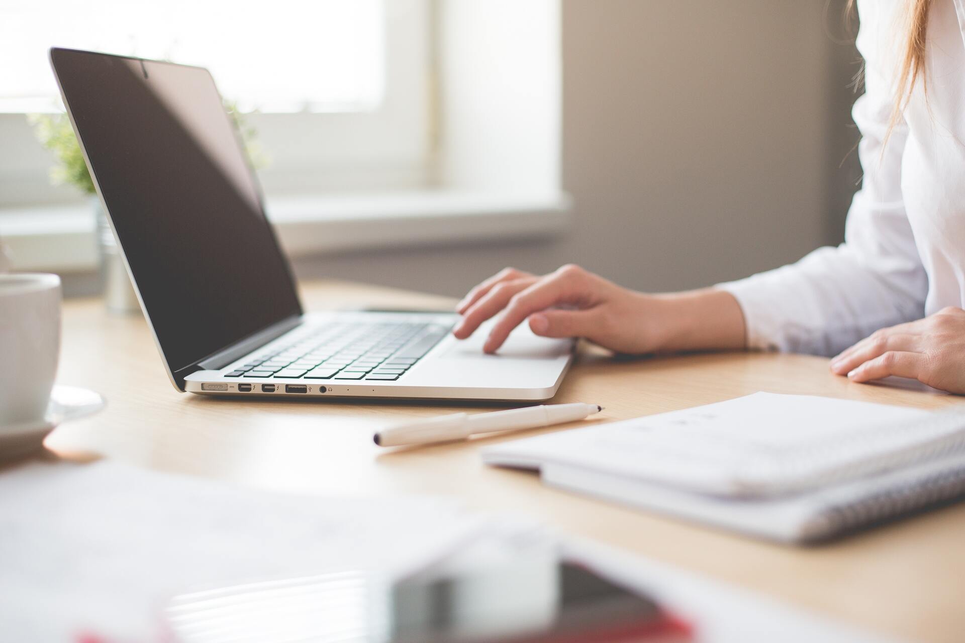 Woman hand on laptop