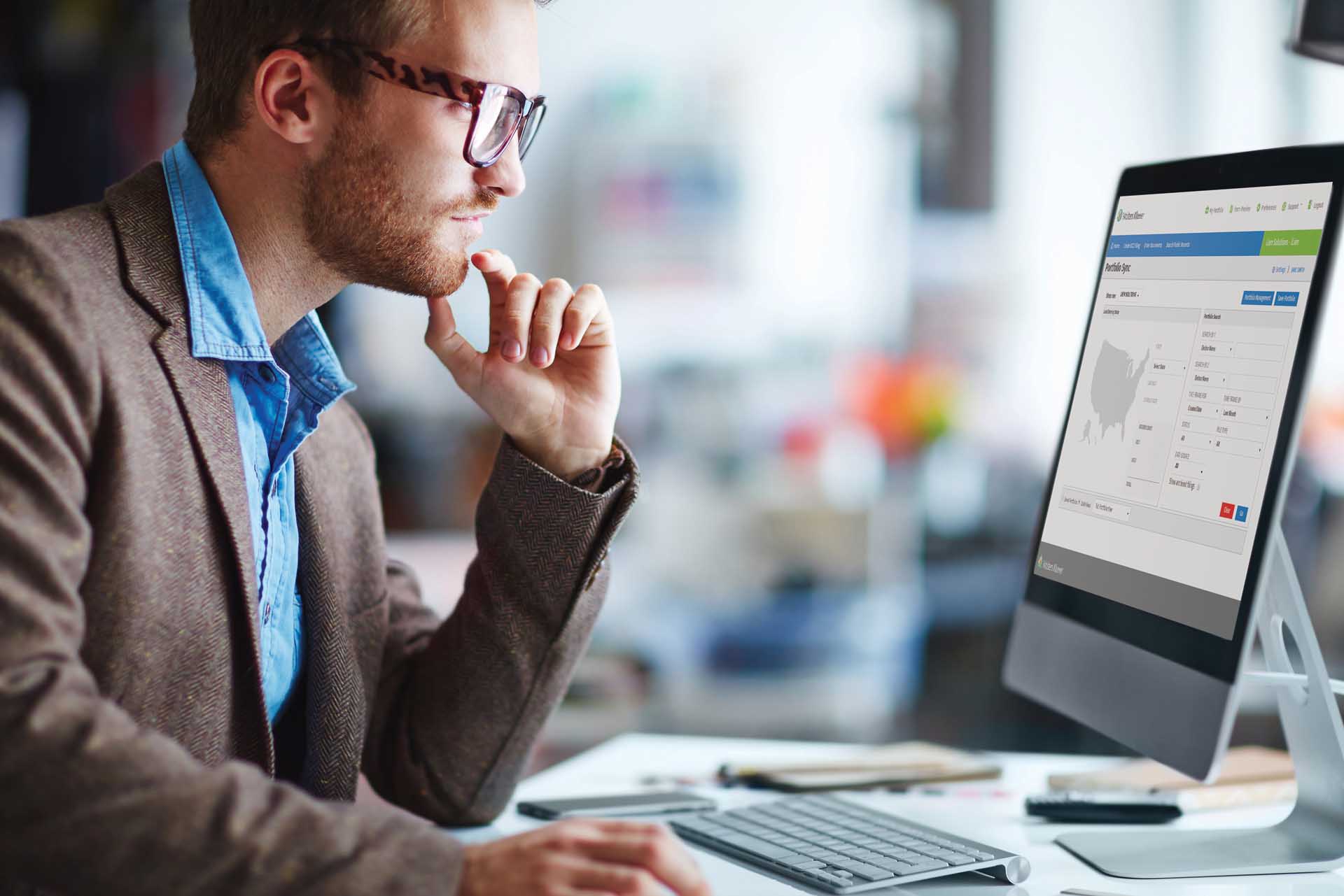 man looking at a computer