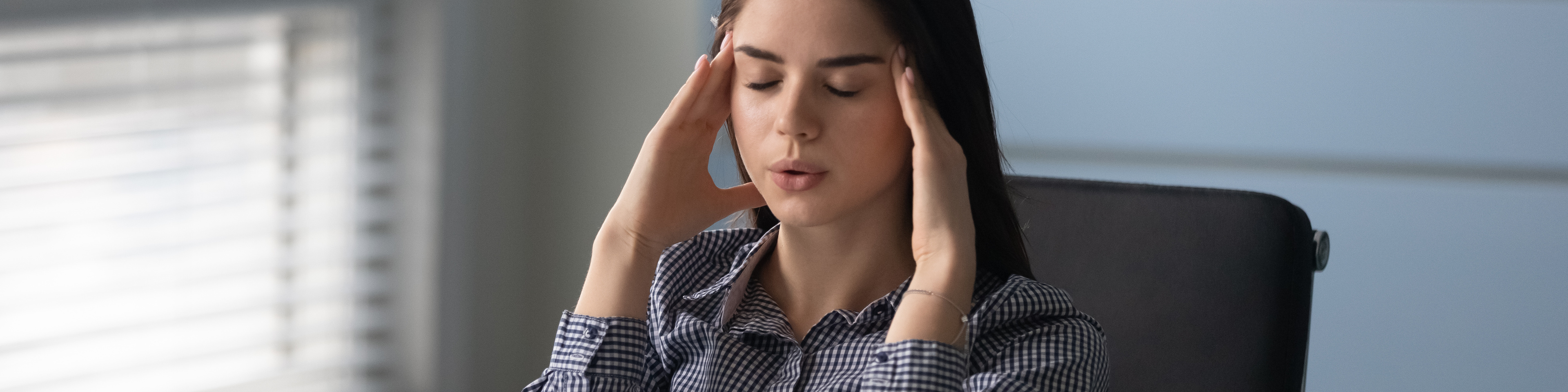 Businesswoman closed eyes makes inhale exhale exercise reducing headache feeling