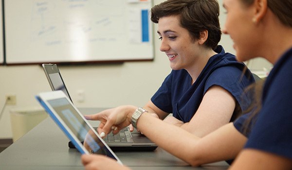 Nursing students in a classroom using an educational EHR, Lippincott DocuCare