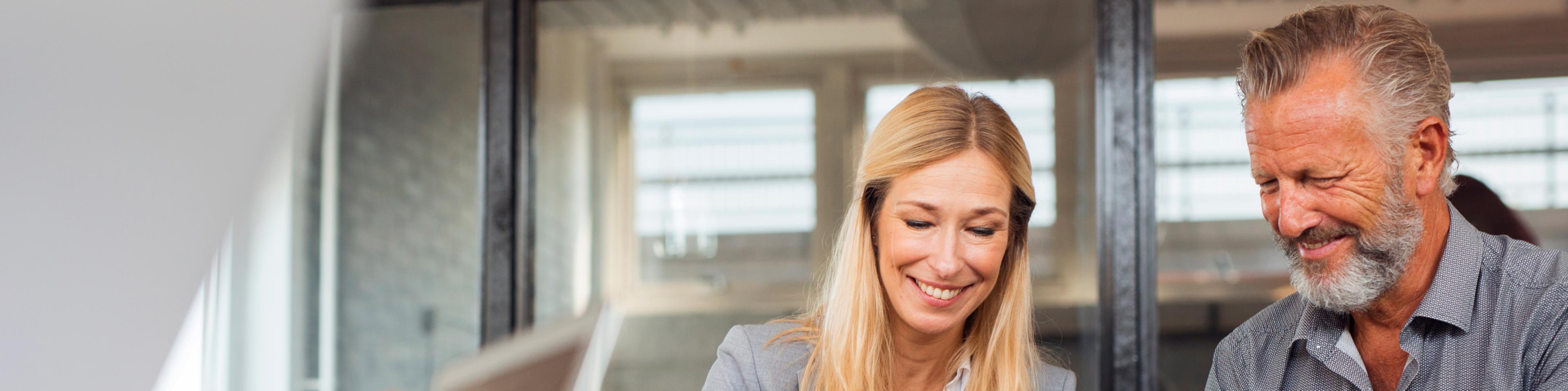 woman and man discussing offering employee retirement benefits