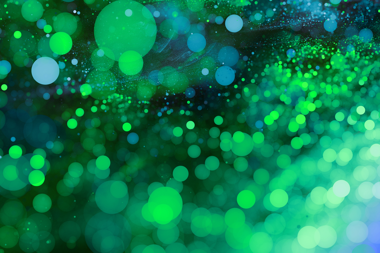 Abstract Green bokeh background. Sparkling spray and circles with depth blur. Fractal artwork for creative design