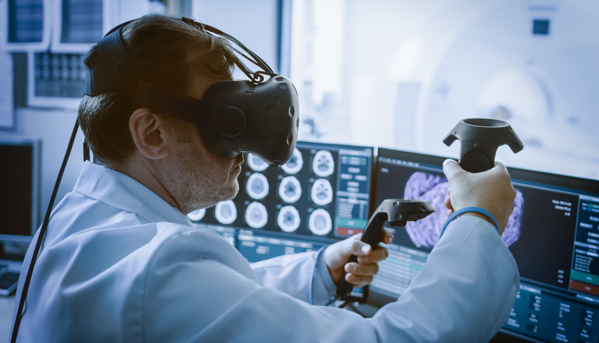 Medical laboratory surgeon wearing virtual reality headset uses controllers to remotely operate patient with medical robot