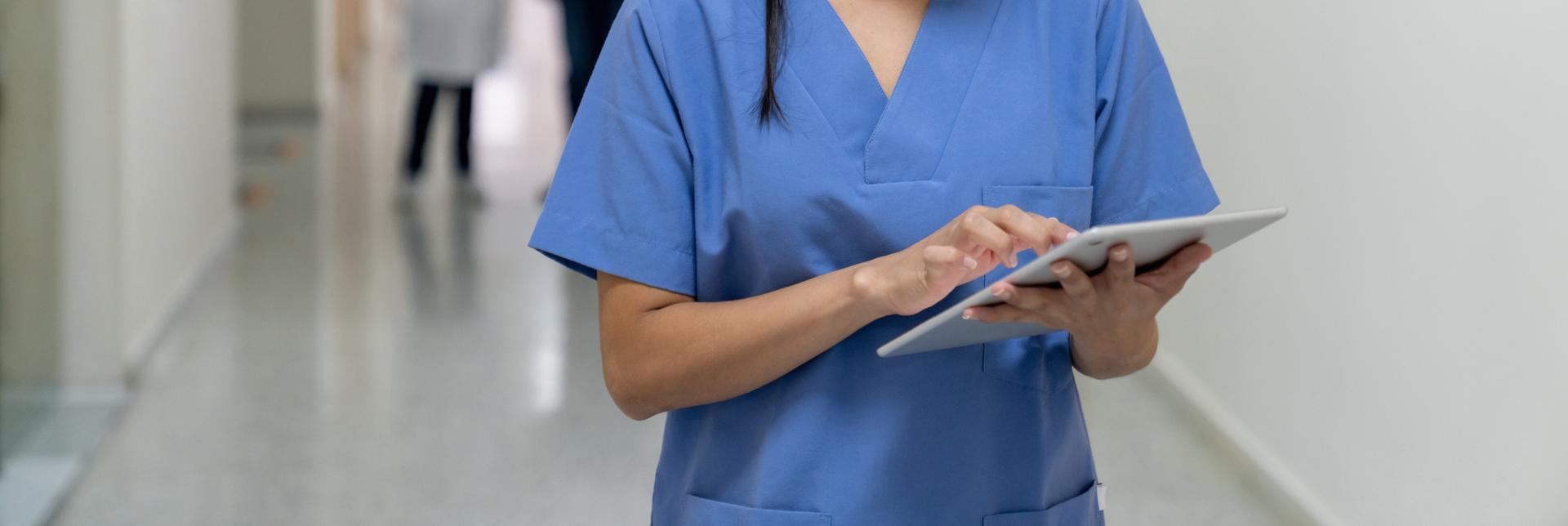 Female nurse using tablet at the hospital