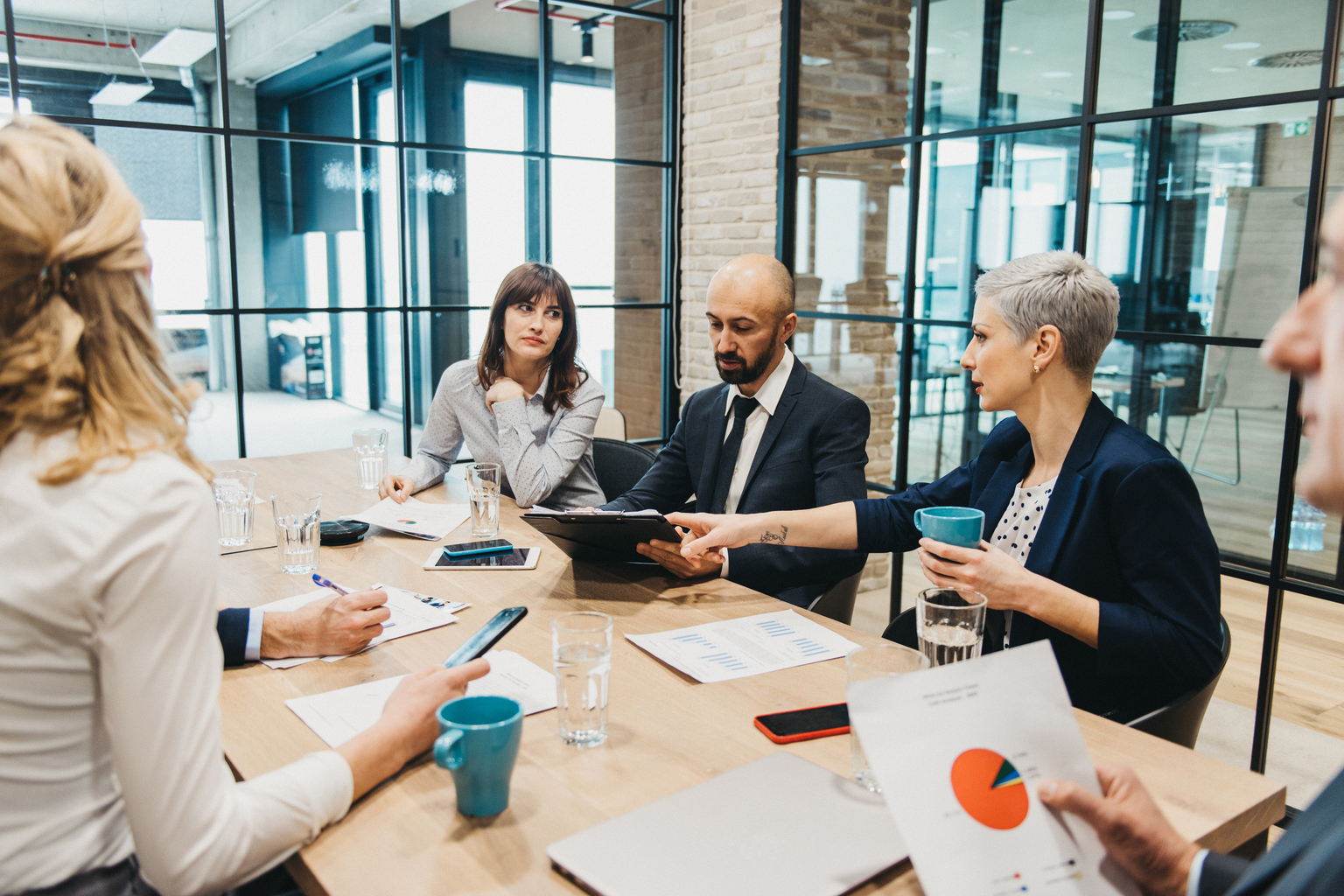 Coworkers discussing in a Board meeting 