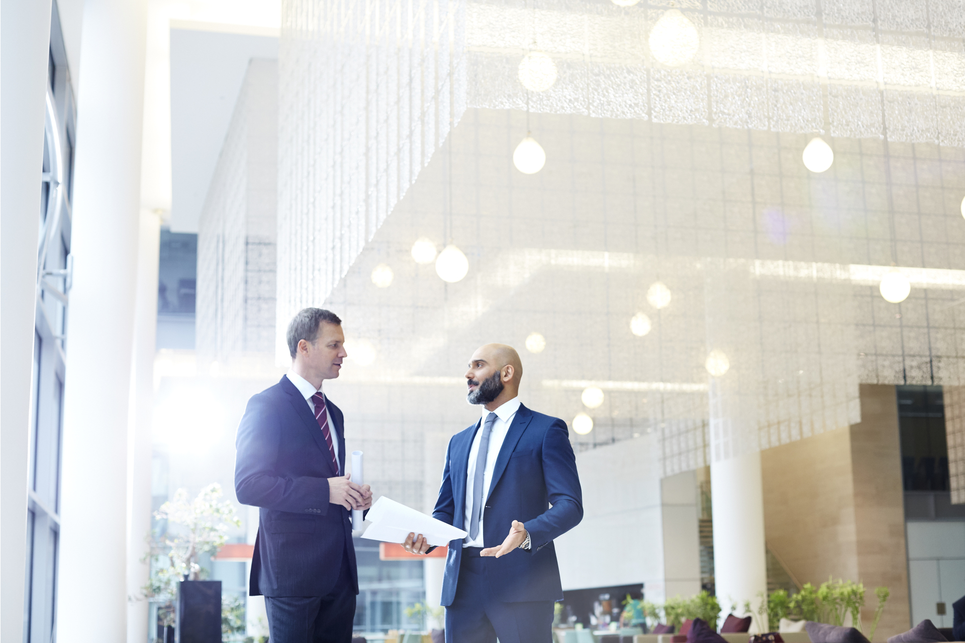 Business men discussing plans in modern office