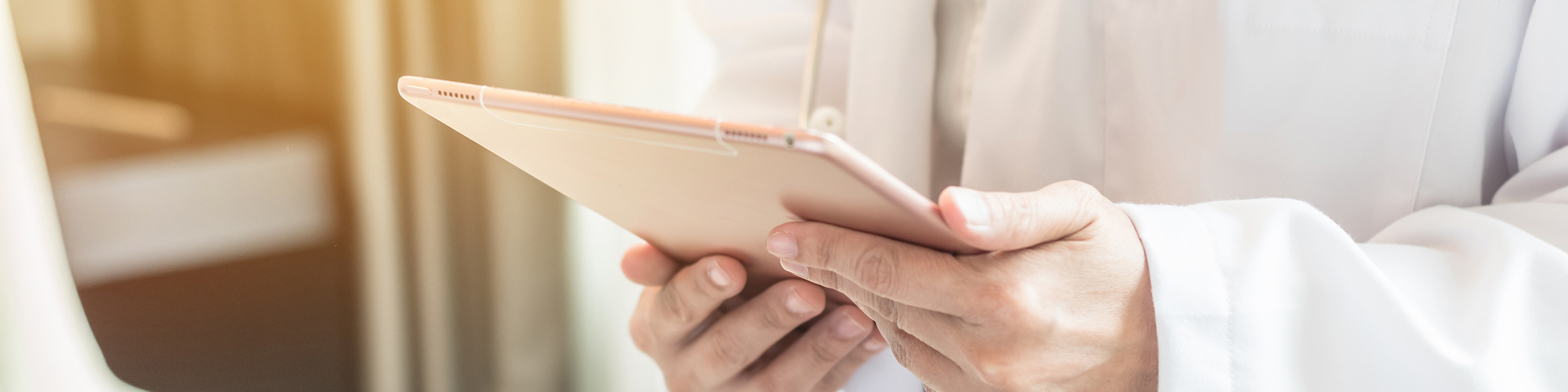 Healthcare professional holding a tablet