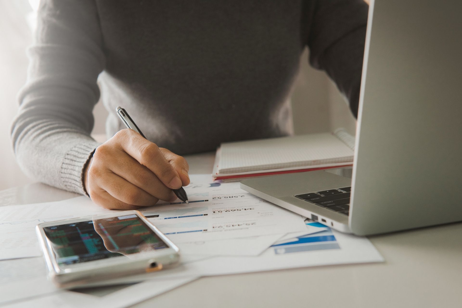 accountant with smart phone and laptop computer