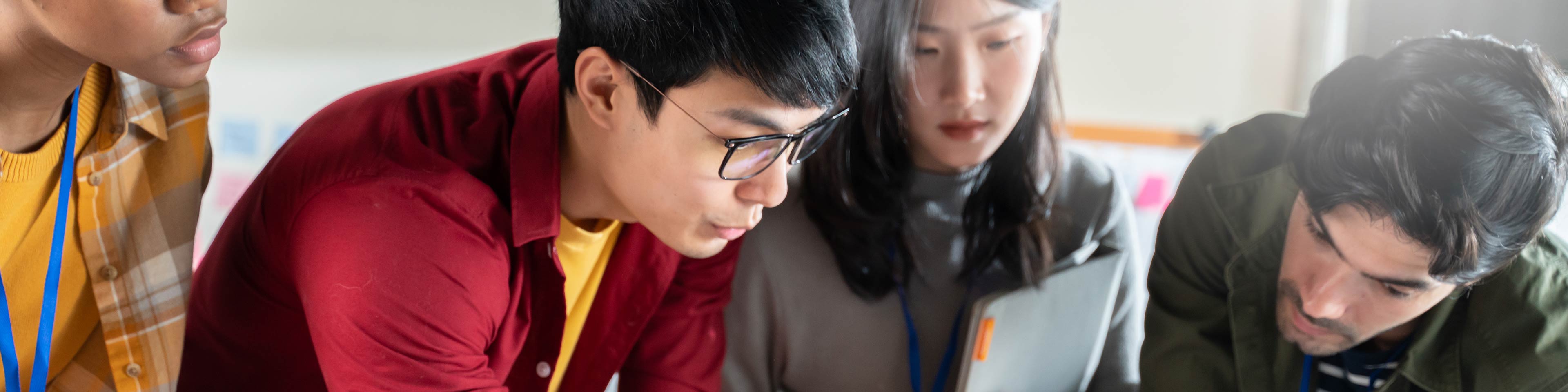 2 men and 2 women reviewing a document