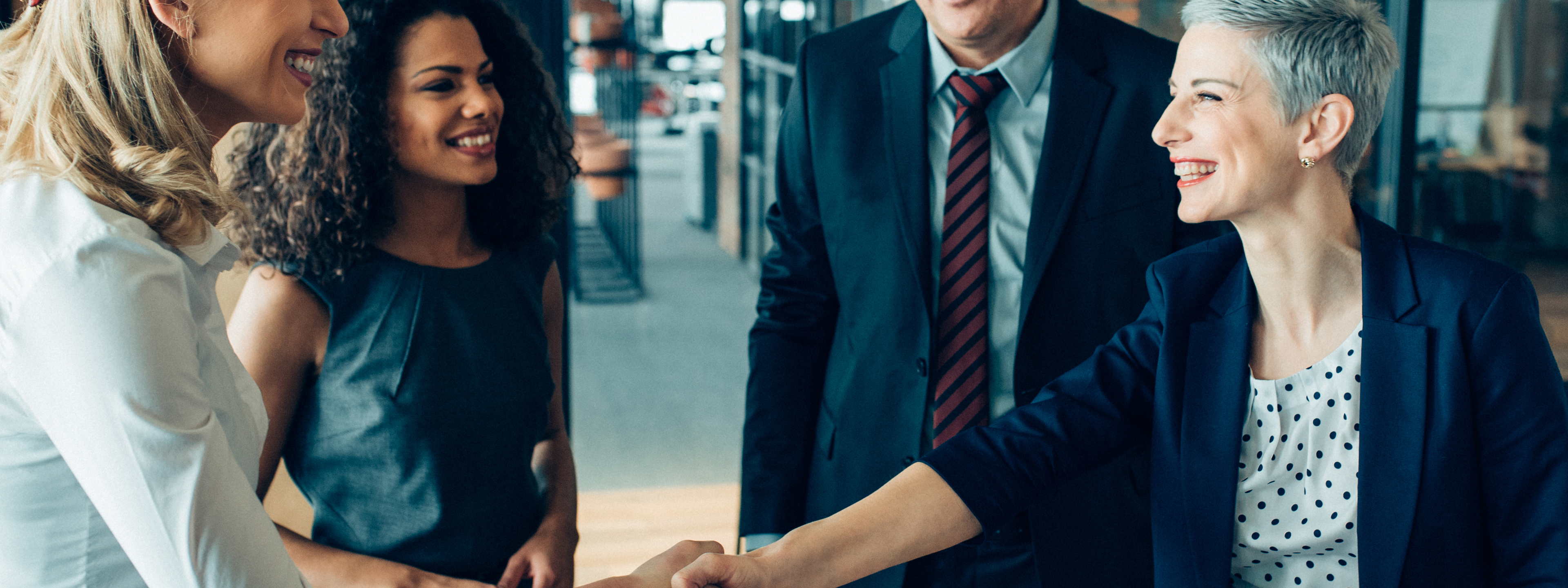 Business people shaking hands after the meeting.