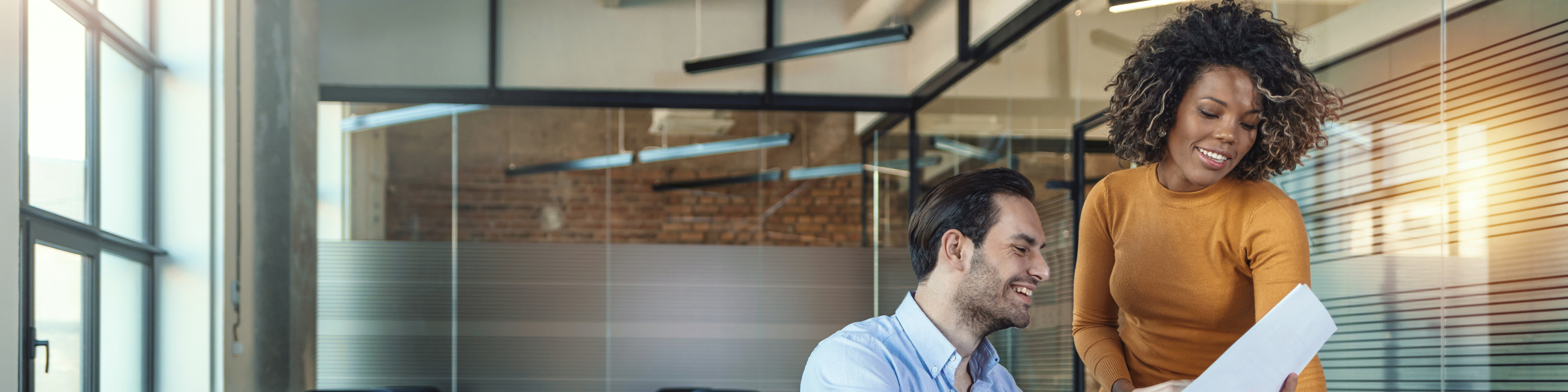 Image of two successful business partners working at meeting in office.