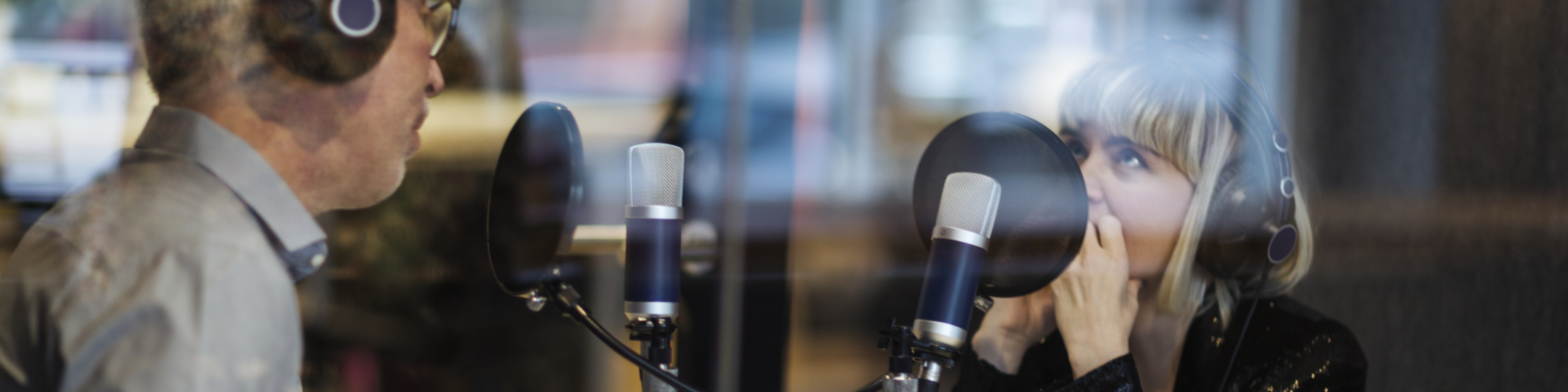 Employees recording a podcast in the office