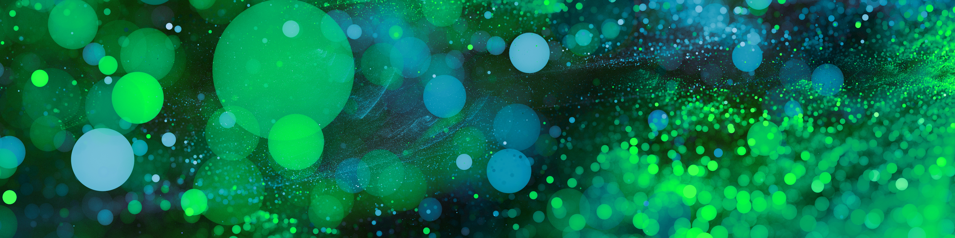 Abstract Green bokeh background. Sparkling spray and circles with depth blur. Fractal artwork for creative design