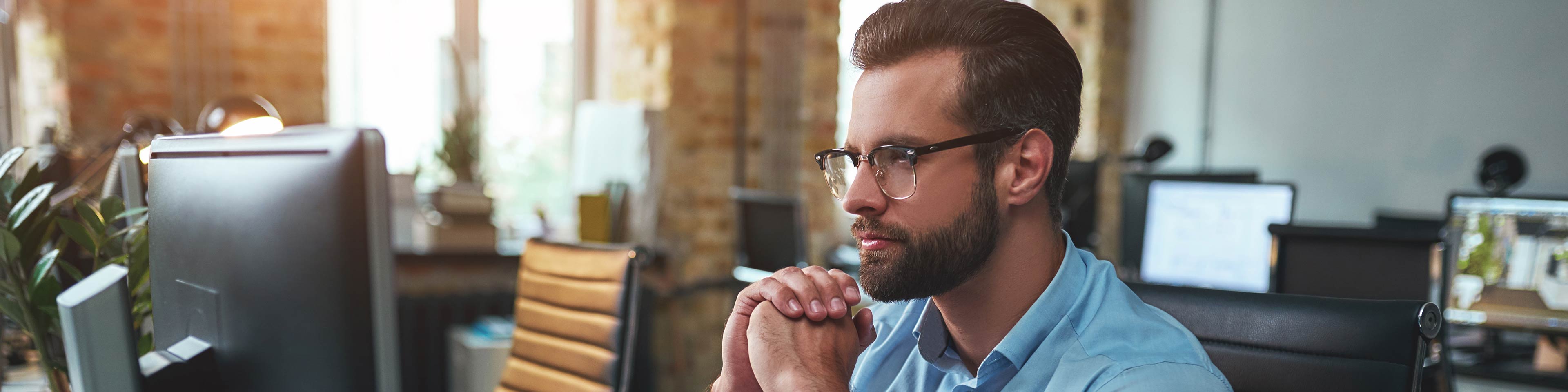 A businessman looking at his computer filing his LLC